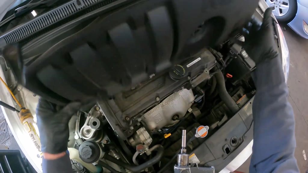 Step 2: Remove the DOHC 16V engine trim cover