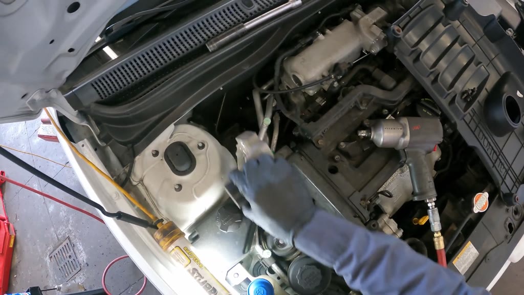 Step 3: Remove the upper engine-mount bridge bracket