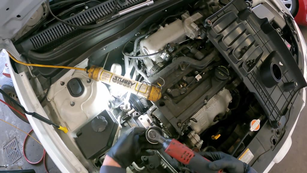 Step 14: Remove the timing-belt idler roller
