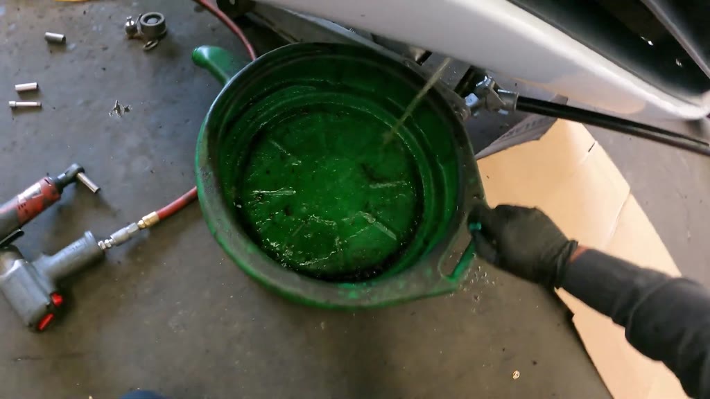 Drain the cooling system and remove the water pump