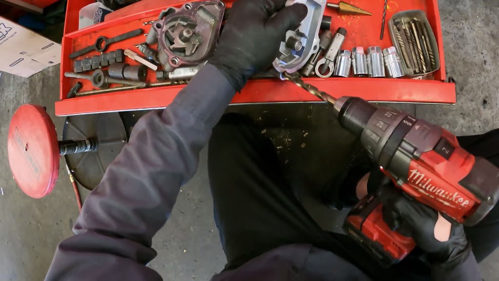 Step 24: Correct the replacement water-pump mounting-hole fit