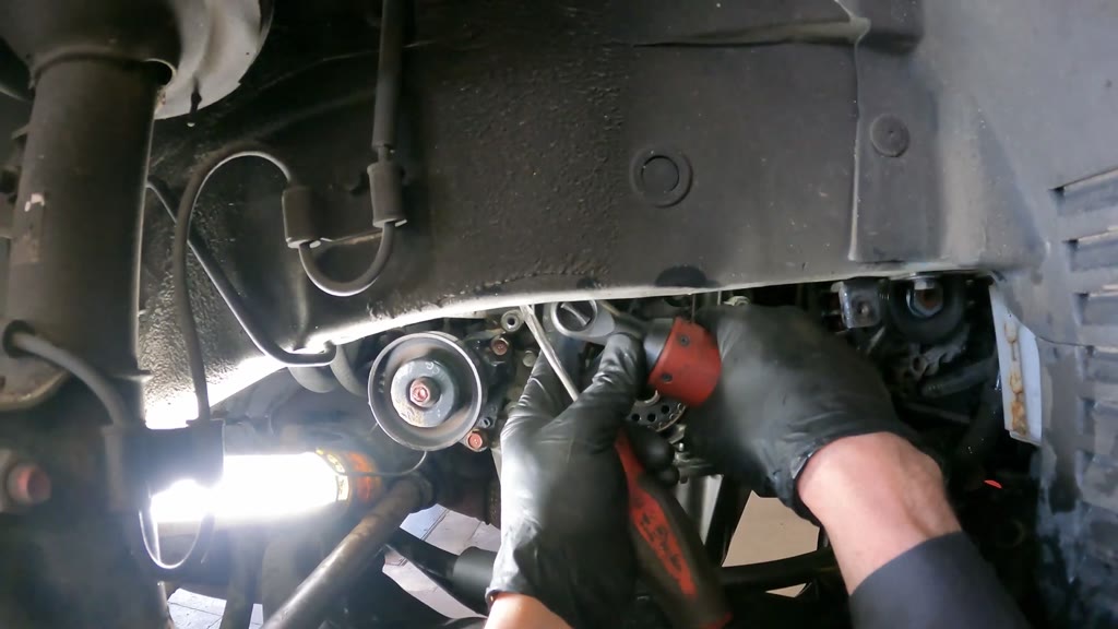 Step 28: Install and adjust the timing-belt tensioner assembly