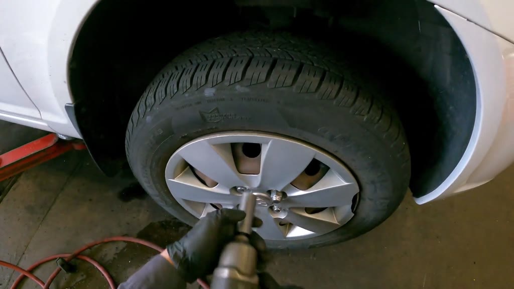 Step 42: Install the front wheel, wheel cover and lug nuts